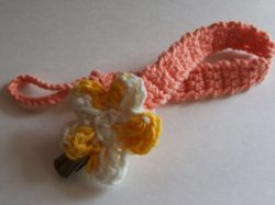 cotton yarn, crochet, pacifier holder, color tea rose with yellow and white flower, 1inch clip, 10in L, loop is 1 1.2in L