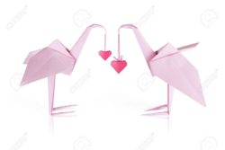 17357291-Origami-pink-paper-loving-flamingo-couple-whith-hears-Stock-Photo