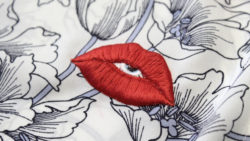 machine-embroidered-lips-logo