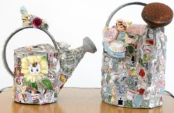 Decorated watering cans made by Mosaic artist Bonnie Arkin (CQ) is one of the many garden pieces that can be covered with a mosaic. Arkin (CQ) will be teaching a mosaic class at the Chicago Botanic Garden in Glencoe, Ill.(Lane Christiansen / Chicago Tribune)