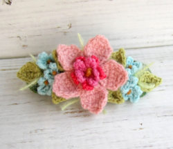 crochet_hair_barrette_pink_with_blue_flowers_by_meekssandygirl-d4tnp4i