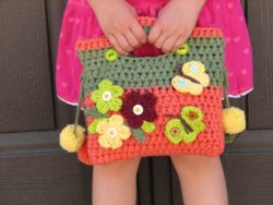 girls_bag__purse_with_flowers_butterfly_and_pom_pom_crochet_pattern__dde7009f