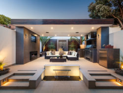 Modern-outdoor-kitchen-doubling-as-a-cozy-lounge-corner