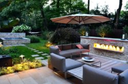 backyard-patio-umbrella-modern-outdoor-patio-designs-combine-grey-sectional-sofa-also-simple-stone-fireplace-over-classic-design-patio-umbrella