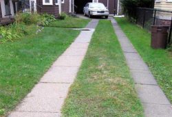 Old-fashioned-concrete-paving-for-ribbon-driveway-2