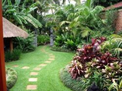 Brick-Wall-and-Tropical-Plants-for-Elegant-Backyard-Landscaping-Ideas