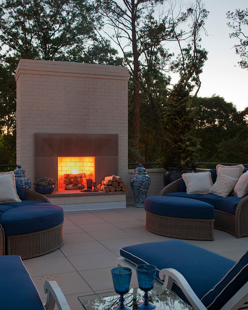 Pretty-Outside-Fireplace-fashion-Atlanta-Contemporary-Patio-Inspiration-with-blue-upholstery-brick-exterior-patio-ginger-jar-glass-table-logs-lounge-outdoor-fireplace-painted